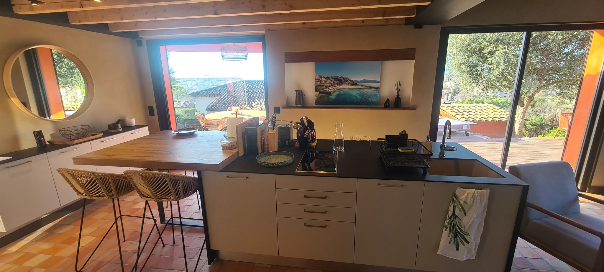 The wooden kitchen island in the open kitchen in the morning light, sample morning scene